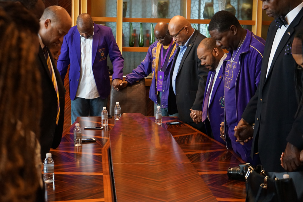 Brothers Praying in China during the Chi Mu Nu Chartering weekend